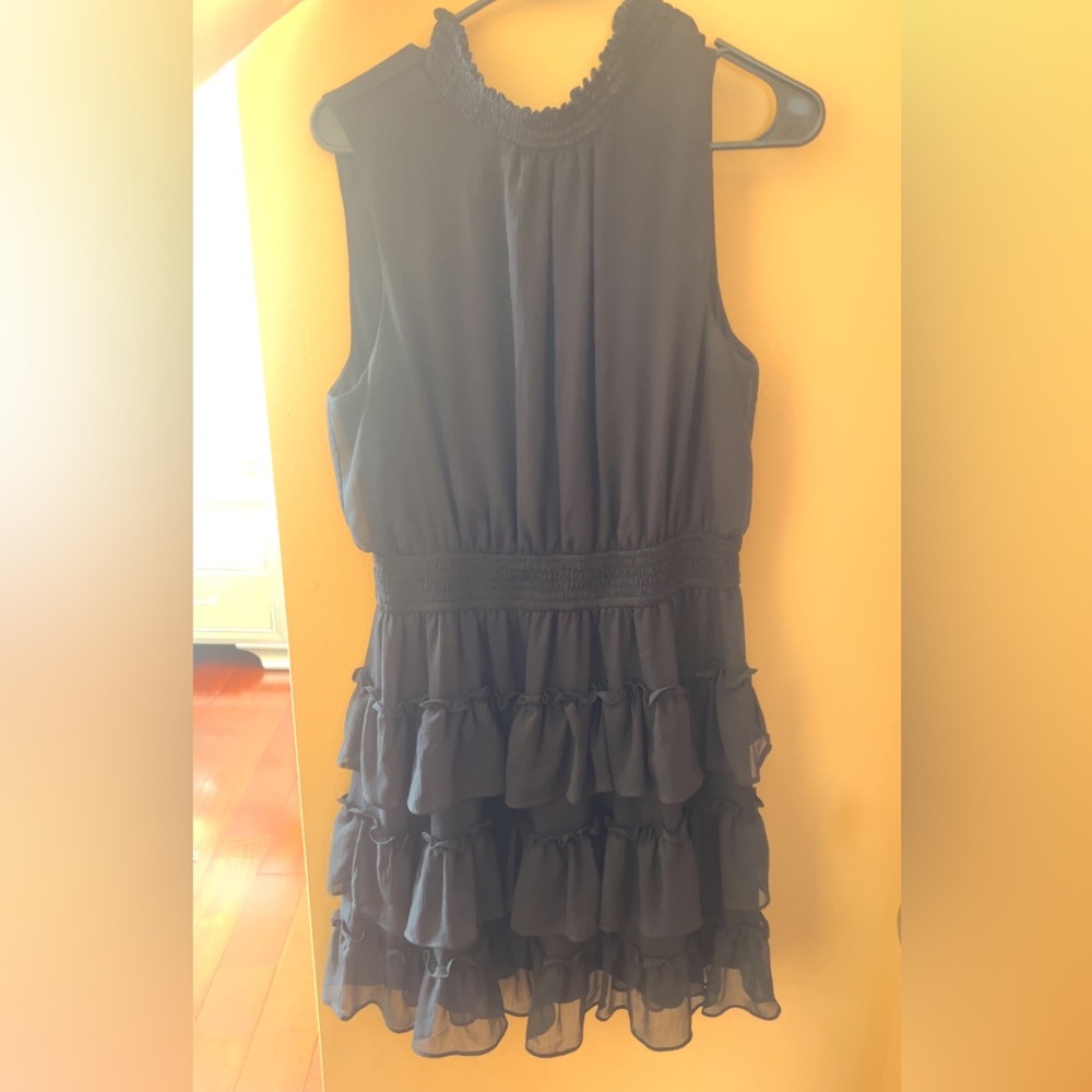 Black smock dress, truffle neck, with ruffles